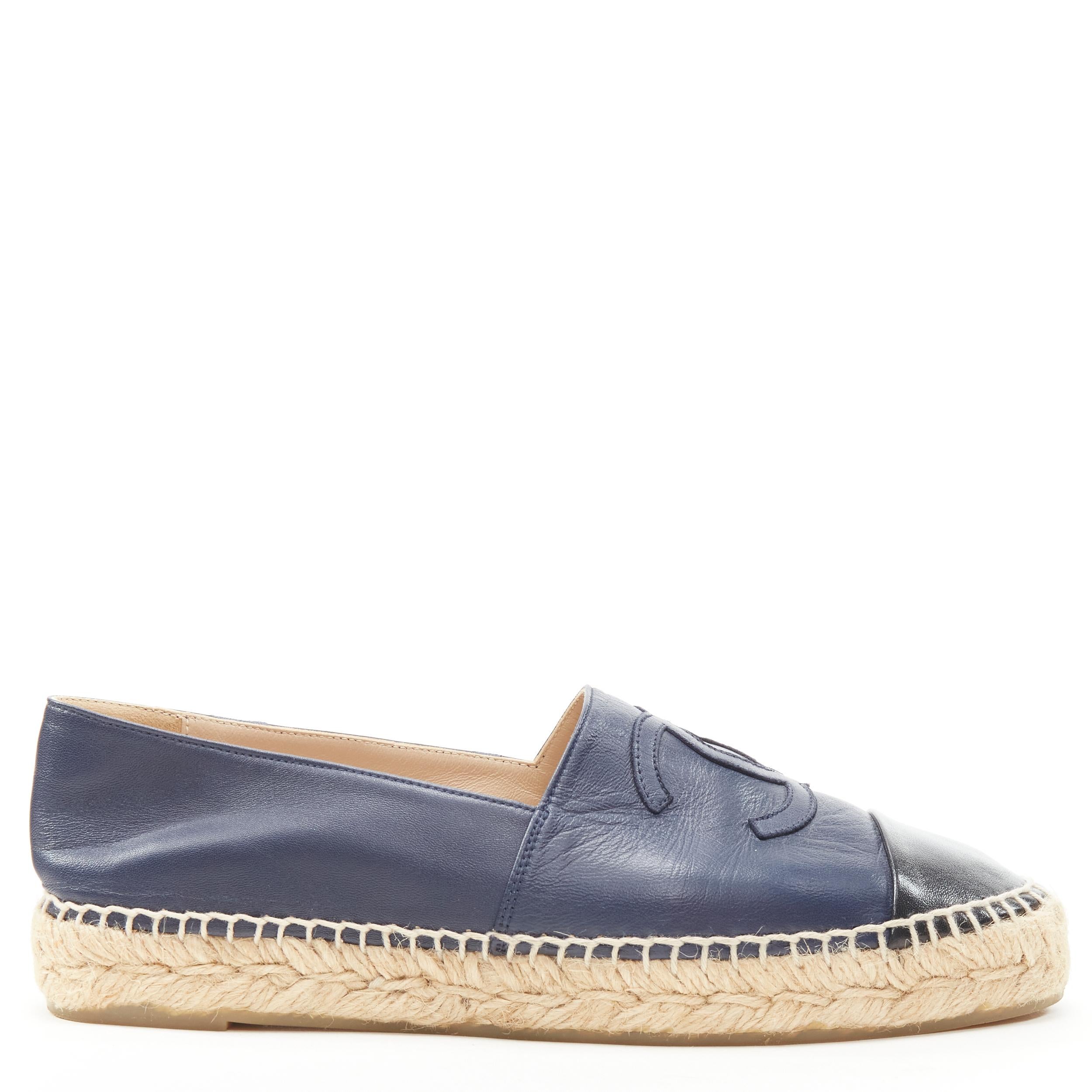 CHANEL CC Logo navy lambskin leather jute espadrilles shoes EU38 US8 
Reference: LNKO/A01927 
Brand: Chanel 
Model: CC Logo espadrilles 
Material: Leather 
Color: Navy 
Pattern: Solid 
Extra Detail: Lambskin leather. CC logo at top. Jute espadrille.