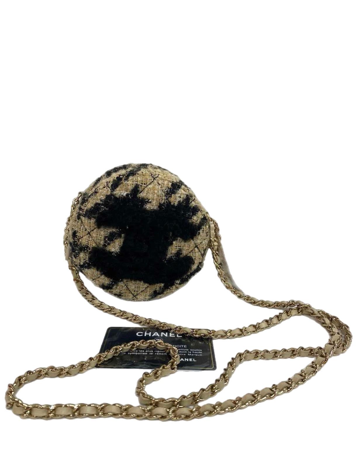 The Chanel CC Logo Round Shearling Chain Shoulder Bag in Beige x Black is a playful yet elegant accessory that showcases Chanel's timeless craftsmanship. The bag's unique round silhouette is crafted from soft shearling in a chic beige and black