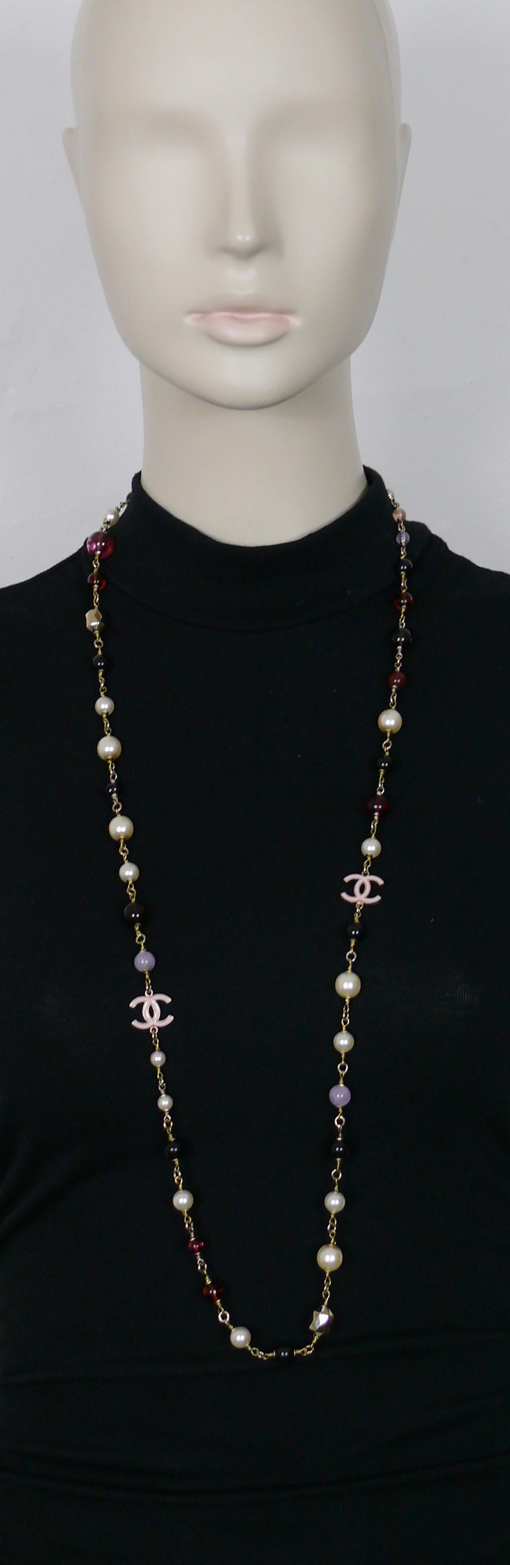 CHANEL pale gold toned necklace featuring multicolored glass beads, gold toned faceted beads, black resin beads, faux pearls and two baby pink enamel CC logos.

Lobster clasp closure.

Laser engraving CHANEL B17 B MADE IN ITALY.

Indicative