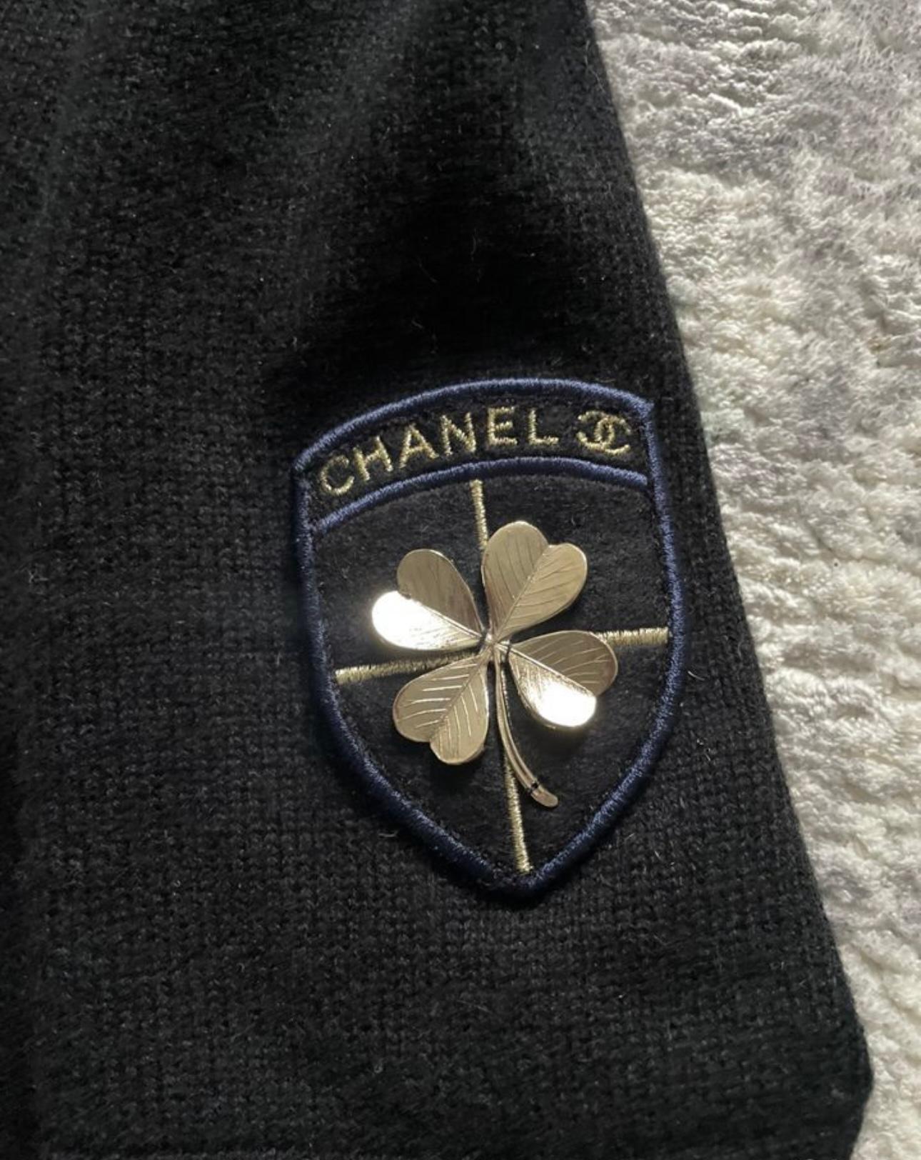 Chanel black cashmere dress with CC Lucky Clover Patch.
- CC logo buttons at pockets
Size mark 46 FR. Condition is pristine.