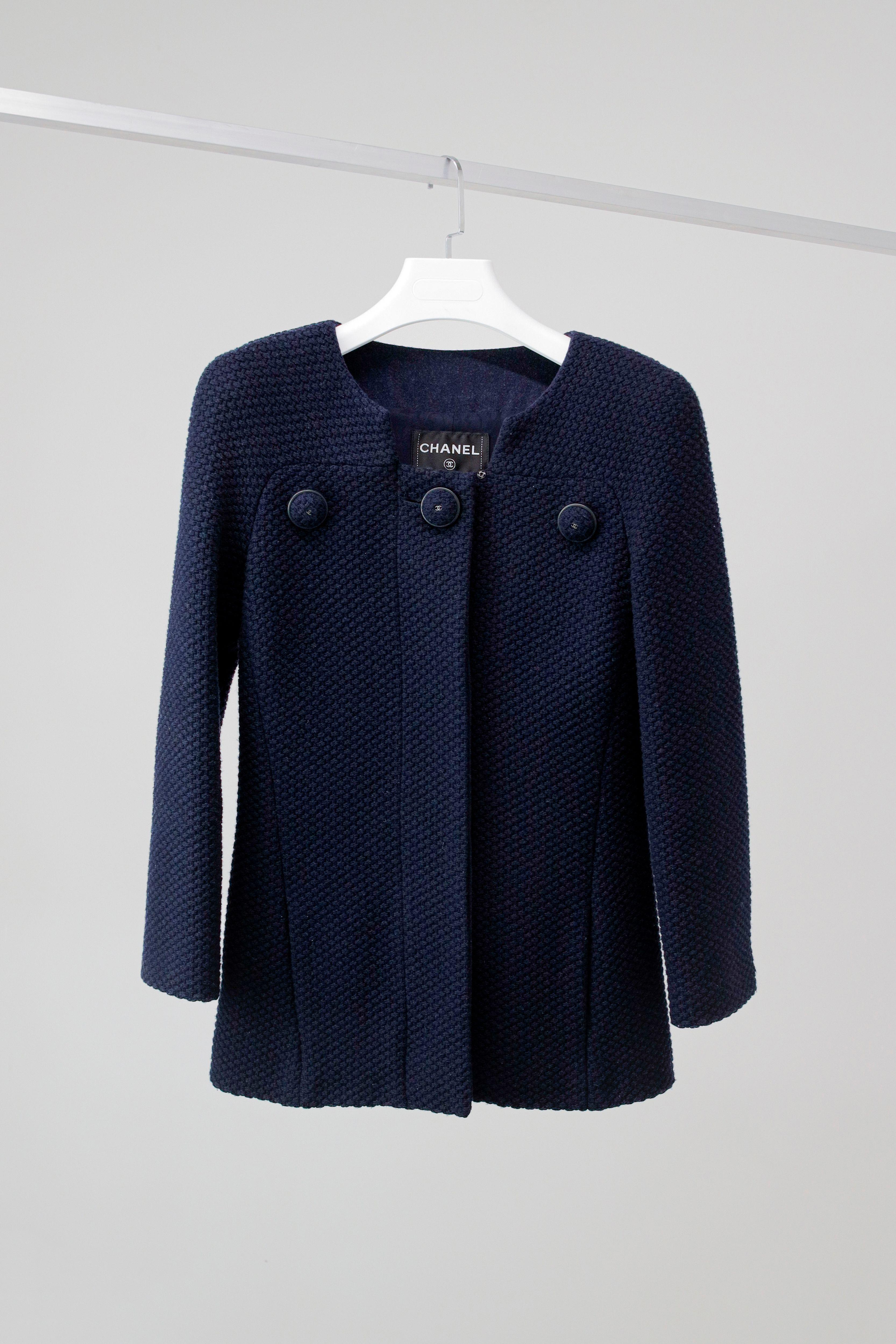 Gorgeous Chanel navy tweed jacket with massive CC logo tweed buttons.
- tonal silk lining with camellias
Size mark 42 FR. Condition is pristine.