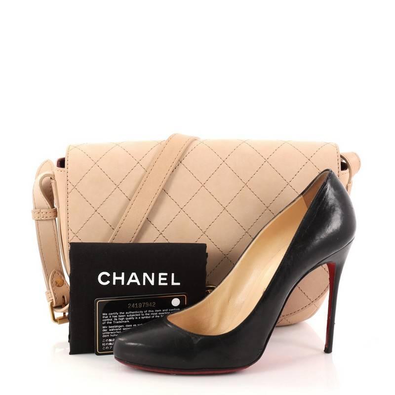 This authentic Chanel CC Messenger Bag Quilted Calfskin Medium mixes casual elegance with a modern twist. Crafted from tan quilted calfskin leather, this gorgeous bag features a adjustable leather strap, front flap with CC logo and brass-tone