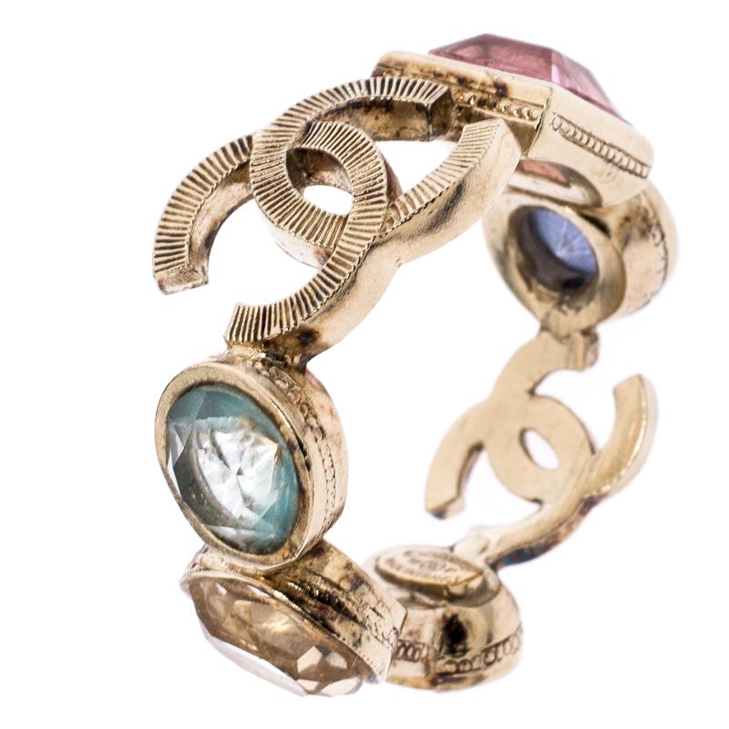 There is no reason to not like this Chanel ring. Featuring cut works, this piece comes in a gold-tone body decked with crystals and signature accents. It exudes an antique appearance that looks best when styled with a coordinating
