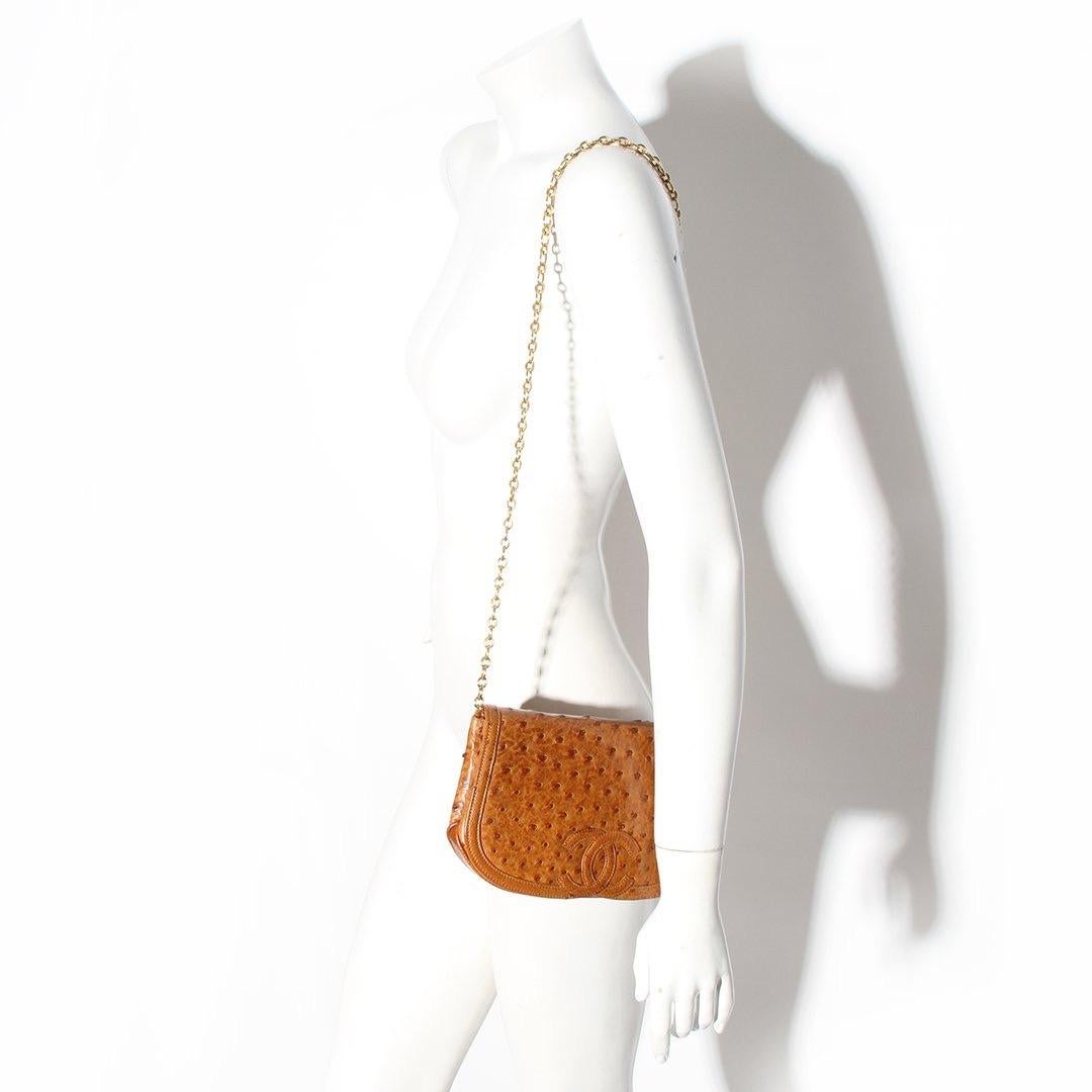 Vintage Ostrich Bag by Chanel
Circa 1992
Brown ostrich leather
Leather CC on front 
Gold tone hardware
Chain shoulder strap easily tucks in to convert to clutch 
Snap closure 
Zip pocket and slit pocket on interior
Chanel stamp and hologram 
Chanel