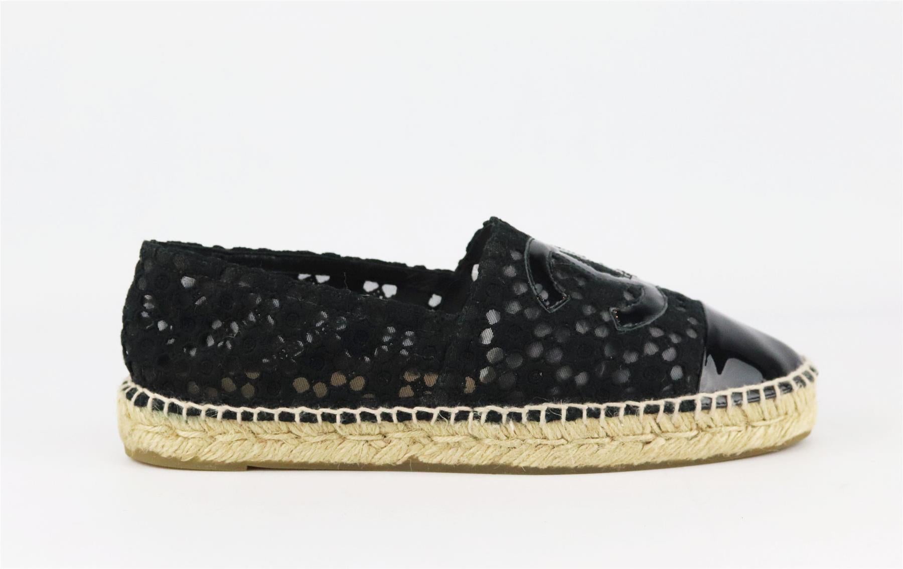 Chanel's classic espadrilles in black crochet, featuring the brand's trademark interlocking CC logo on the front in a black patent leather, they have a thick jute sole and a reinforced toe which offers a comfortable and supportive fit. 
Sole