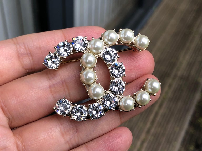 Chanel CC Pearl and Crystal Silver Colour Brooch at 1stDibs