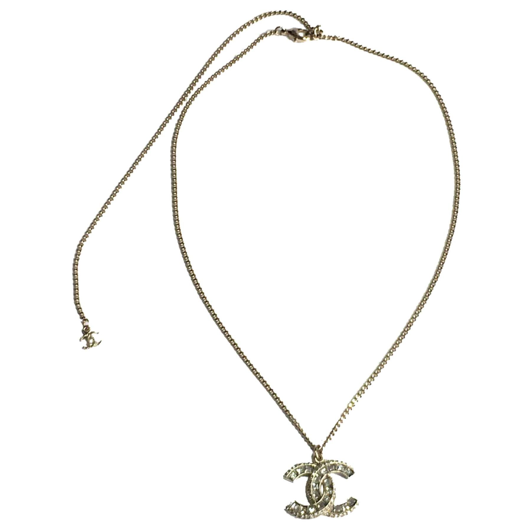 CHANEL CC Pendant Necklace in Gilt Metal and Strass