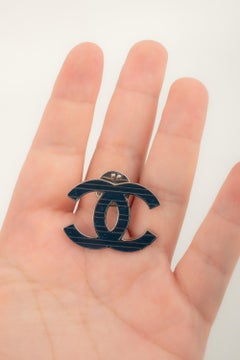 Chanel cc pin label by Karl Lagerfeld circa 2015