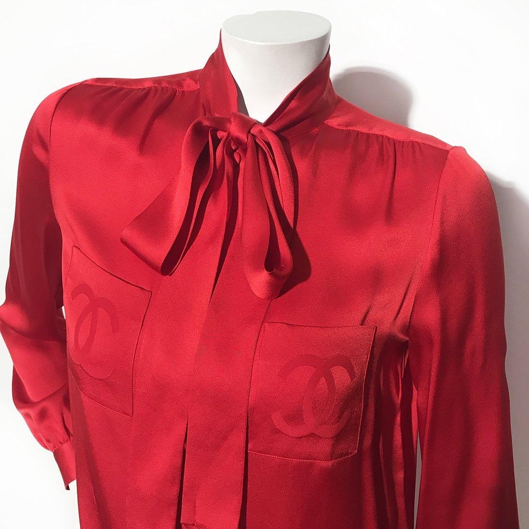 CC pocket blouse by Chanel boutique
Red satin 
Double front 