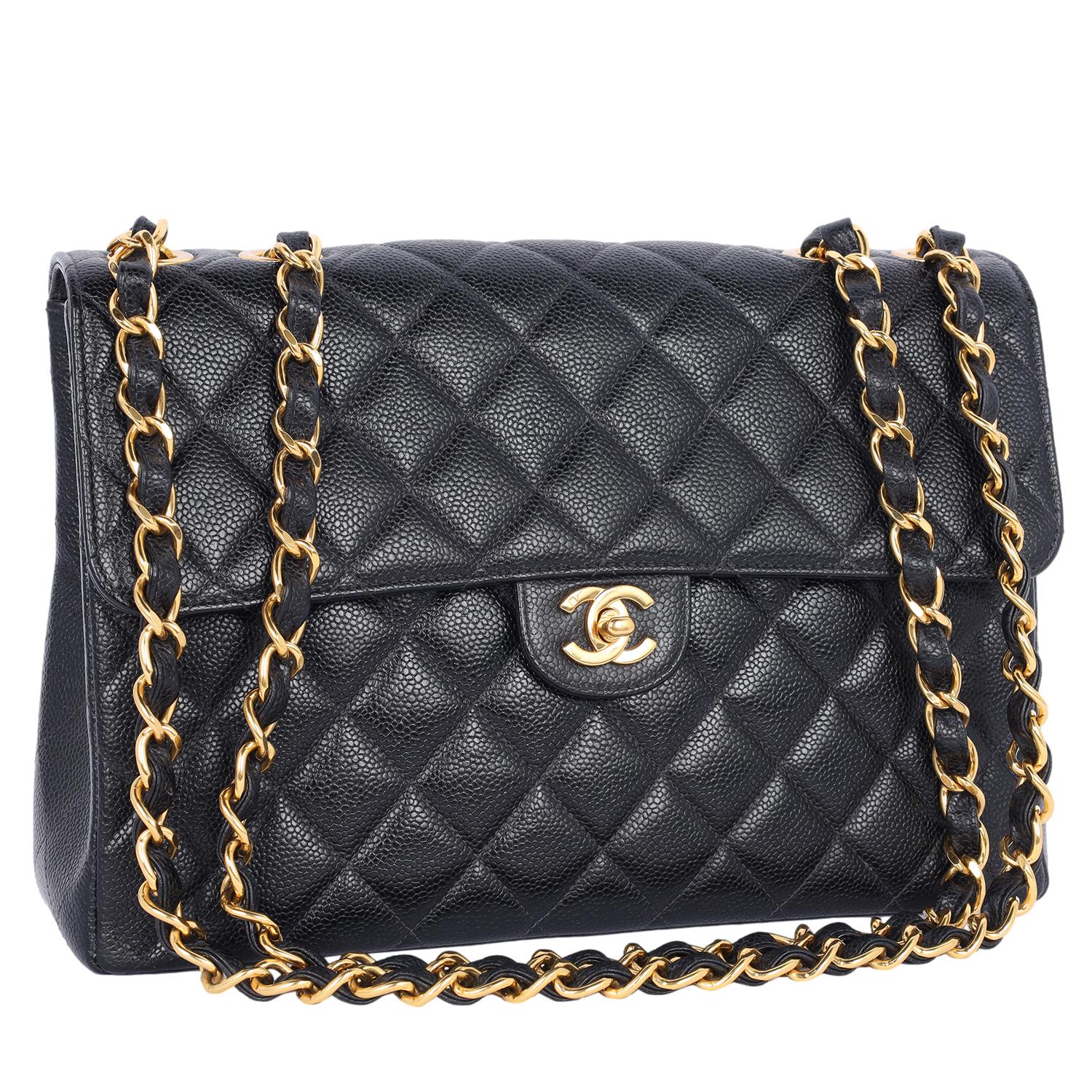 Authentic, pre-loved Chanel CC classic flap jumbo quilted black caviar leather cross body bag. Features flap top with 24kt gold plating CC twist turn lock on the front of the bag, the exterior rear has 1 open side pocket, the interior has Chanel