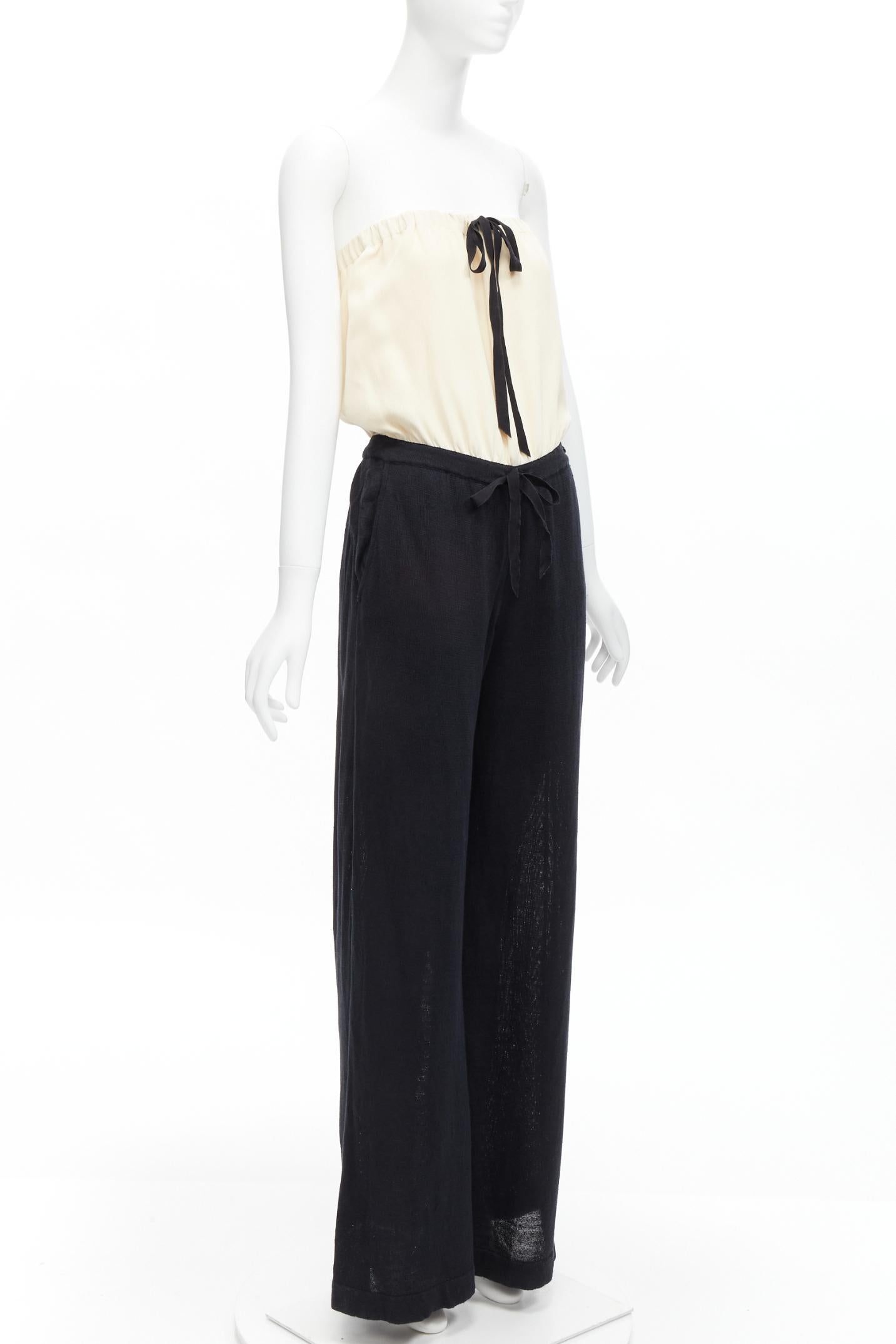 CHANEL CC resin button black beige linen strapless wide leg jumpsuit FR40 L
Reference: TGAS/D00081
Brand: Chanel
Designer: Karl Lagerfeld
Material: Linen, Polyamide
Color: Cream, Black
Pattern: Solid
Closure: Elasticated
Lining: Black Silk
Extra