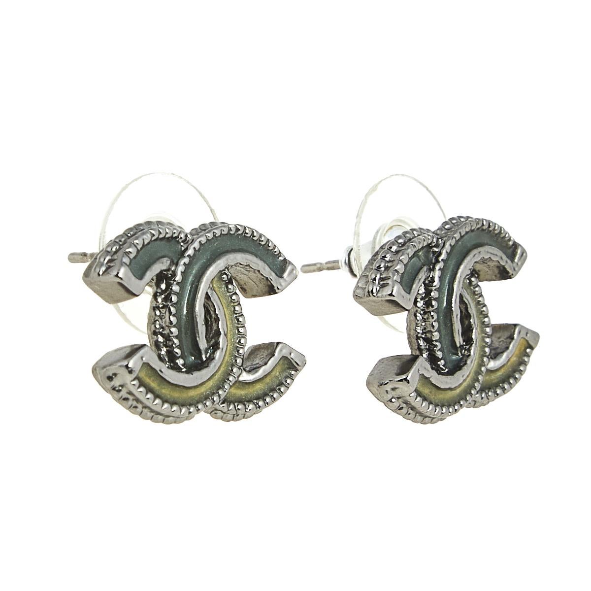 These stud earrings from Chanel are sure to win your heart. The earrings are crafted from silver-tone metal in the shape of the iconic CC logo and detailed with resin. They come equipped with push-back closure.

Includes: Original Box