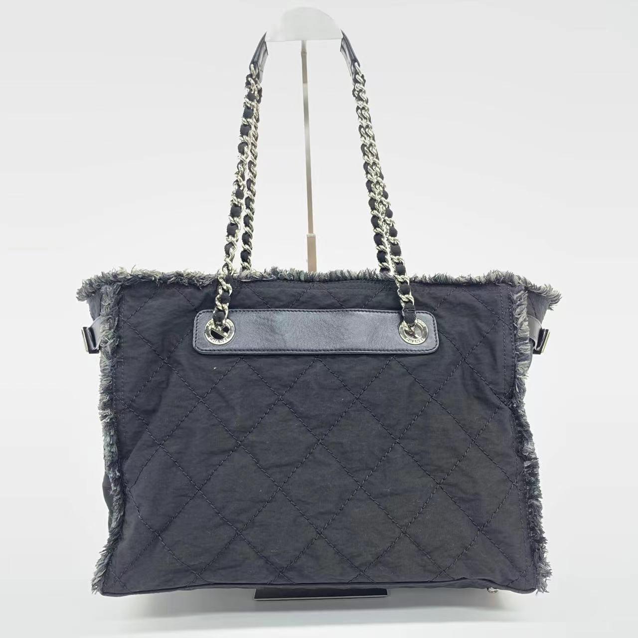 Chanel CC Shopping Tote Medium Blue
 These are professional photos of the actual bag offered by Luxbags.
 Chanel CC Shopping Tote bag in blue cloth with chain handle. ;;Very good condition. Minor crease on the leather handle, light scuffing on the
