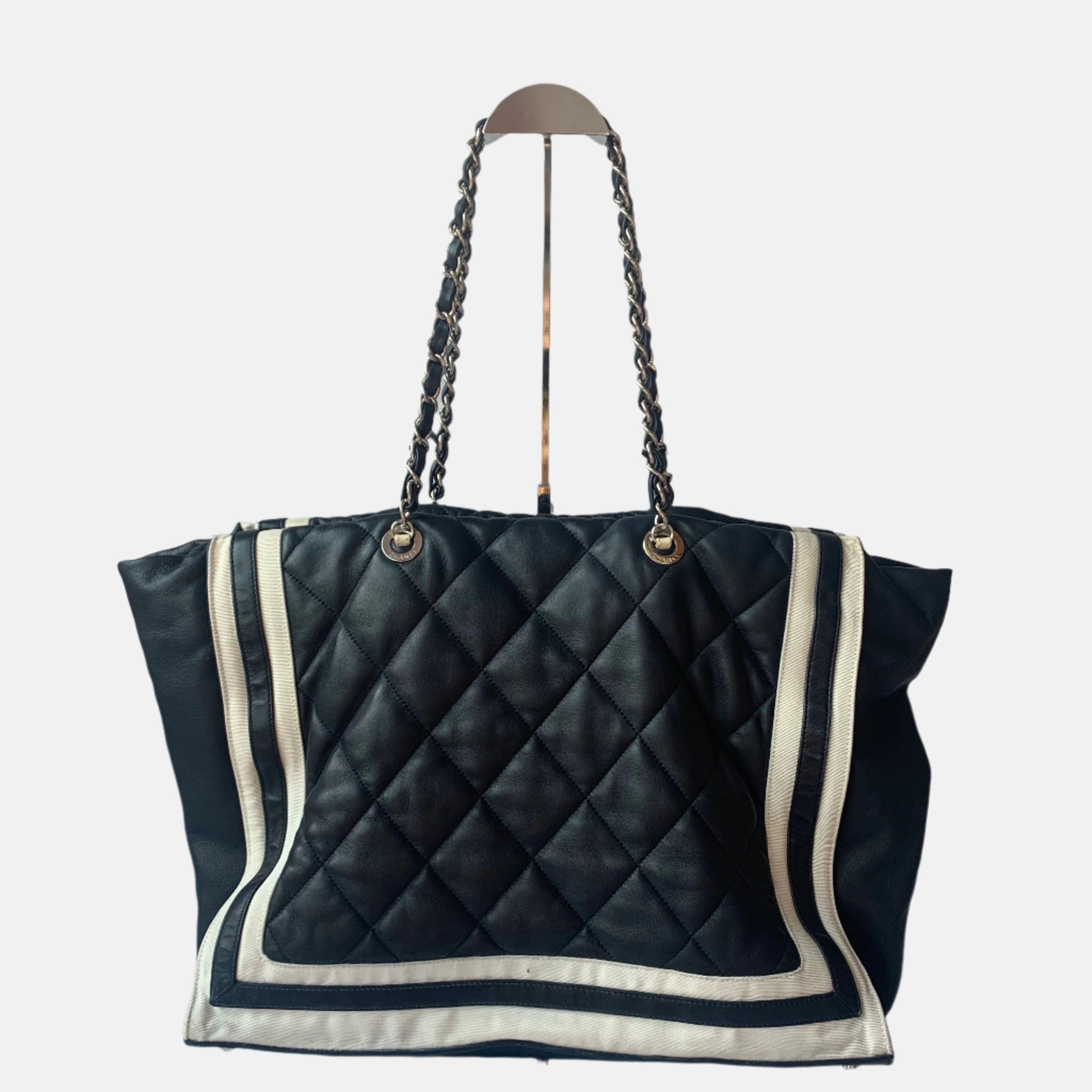 Chanel CC Shopping Tote Medium Cannage Lambskin Leather Navy with White Stripes

  Chanel CC Shopping Tote bag in blue cloth with chain handle. CONDITION: Very good condition. 
  Light scuffs around the bottoms. Item has been professionally cleaned
