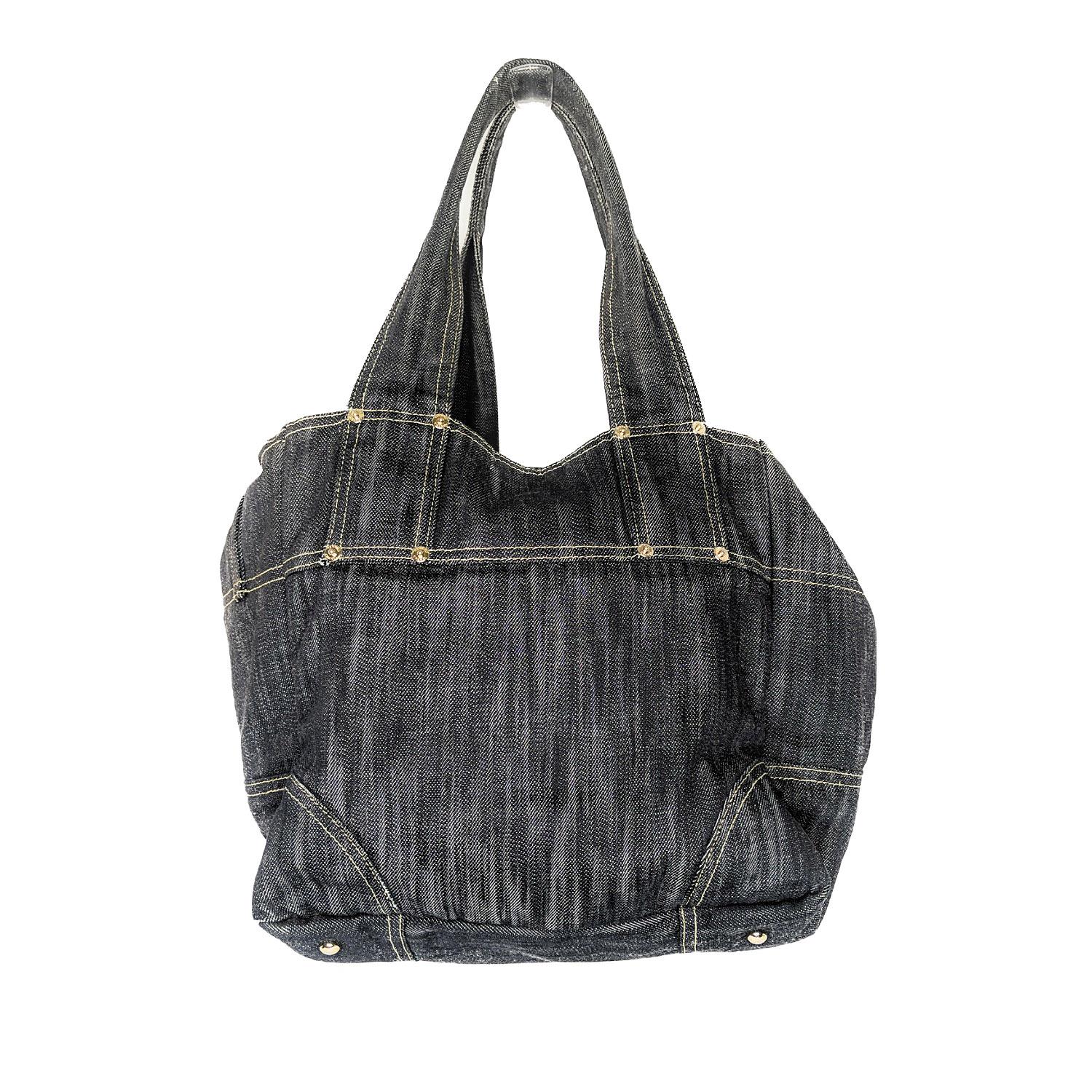 Blue dark wash denim Chanel tote bag with gold-tone hardware, dual flat shoulder straps featuring button embellishments, contrast stitching throughout, CC accents at front, tonal denim interior, five slip pockets at interior wall and dual snap
