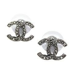 CHANEL CC Stud Earrings in Aged Silver Metal and Rhinestones