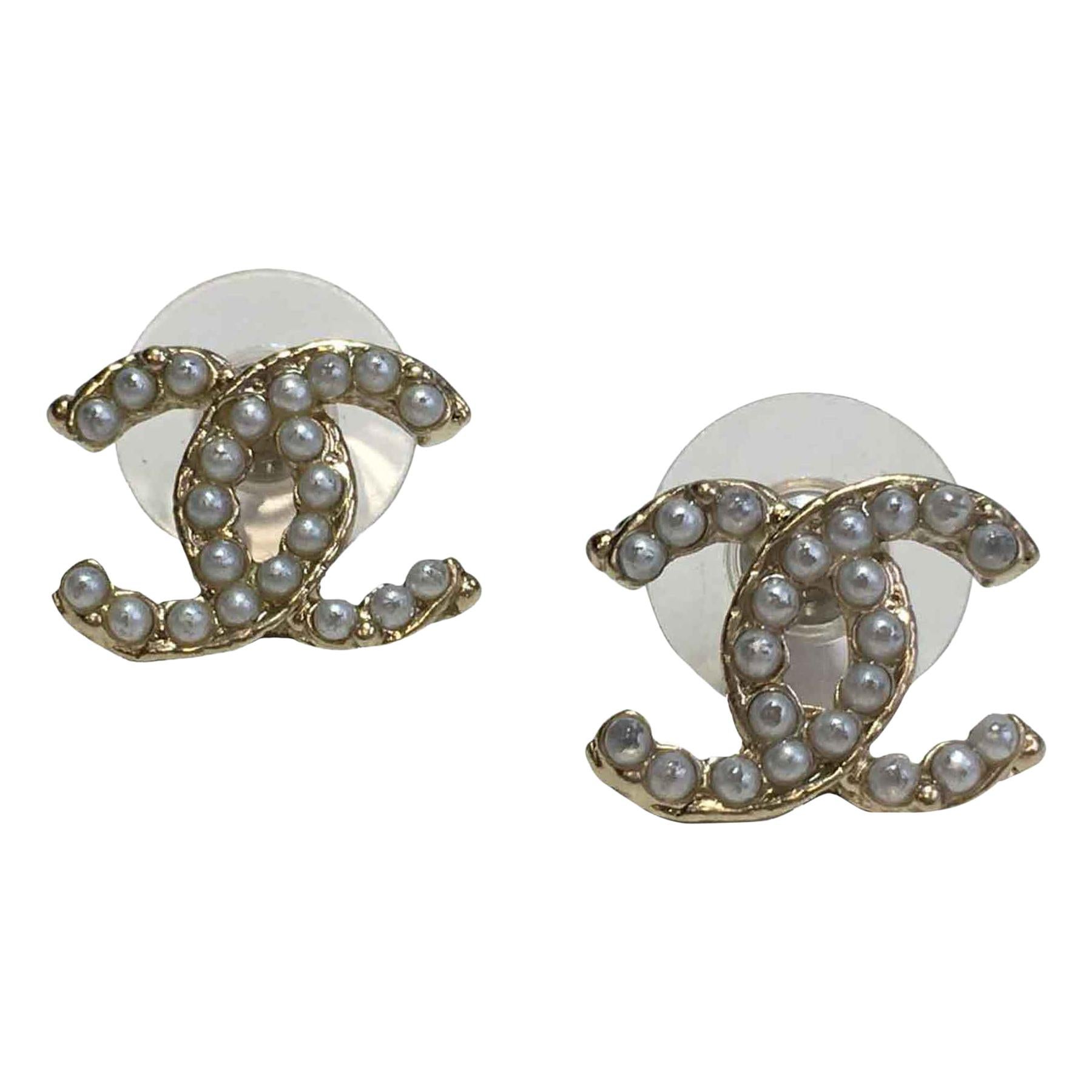 CHANEL CC Stud Earrings  in Gilt Metal set with Pearl Beads.