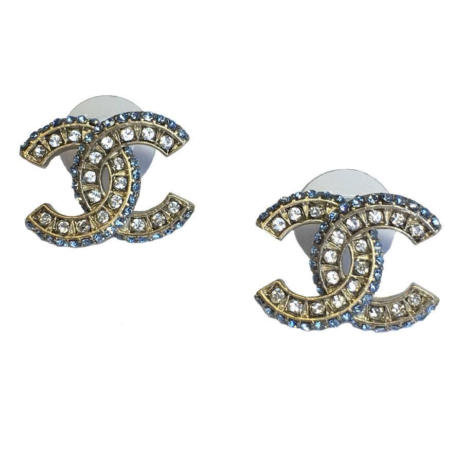 CHANEL CC Stud Earrings in Matte Gilded Metal and White and Sky Blue Rhinestones
