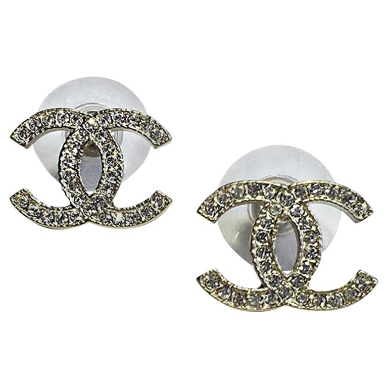 CHANEL CC Stud Earrings in Pale Gilded Metal 