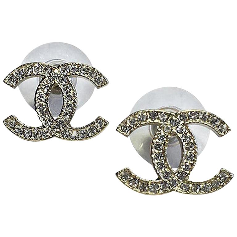 CHANEL CC Stud Earrings in Pale Gilded Metal at 1stDibs  chanel c stud  earrings, channel studs, chanel earrings stud