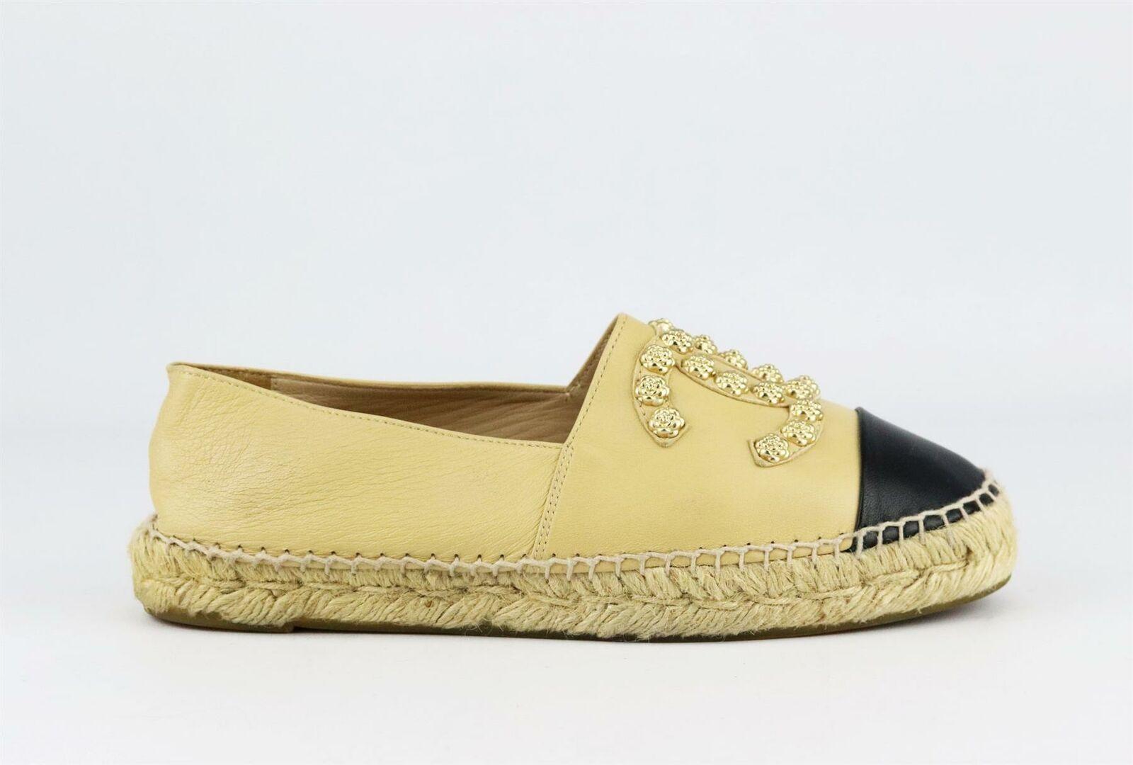 Chanel's classic espadrilles in beige leather, featuring the brand's trademark interlocking CC logo on the front in a gold-tone camellia studded design, they have a thick jute sole and a reinforced toe which offers a comfortable and supportive