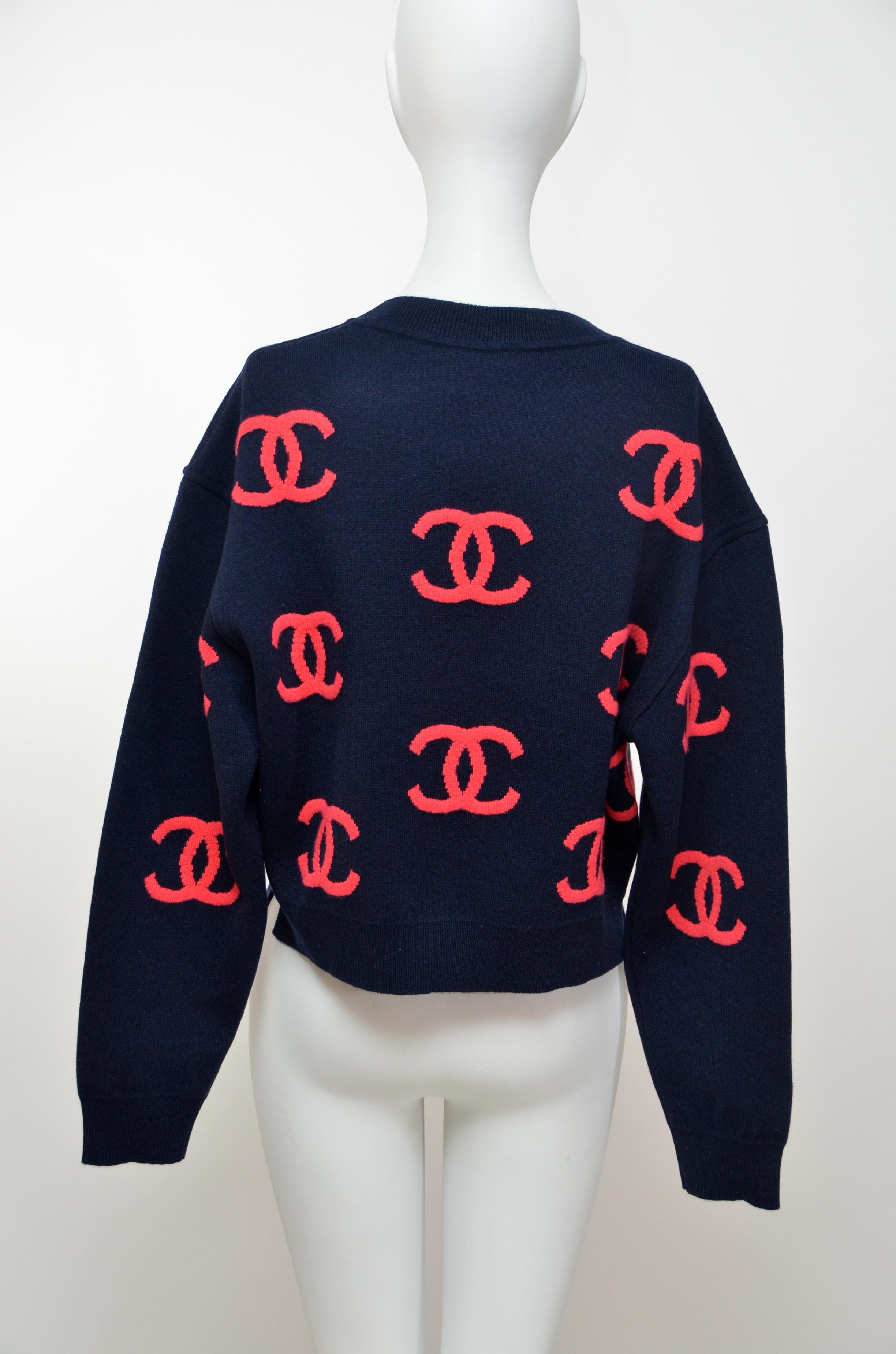 100% authentic Chanel sweater.Original receipt from Chanel available to purchaser upon request.
New with tags and knit pouch
Size 36 
Main base color in person is dark blue.Style is cropped .
Please familiarize yourself with Chanel fit before