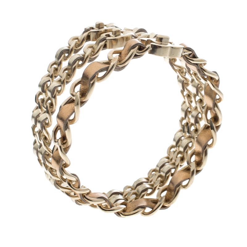 Add a truly elegant touch to your jewellery collection with this Chanel set that personifies style in a classy way. A set of three, these bangle bracelets are styled as gold-tone chains with metallic leather laced through them. Complete with