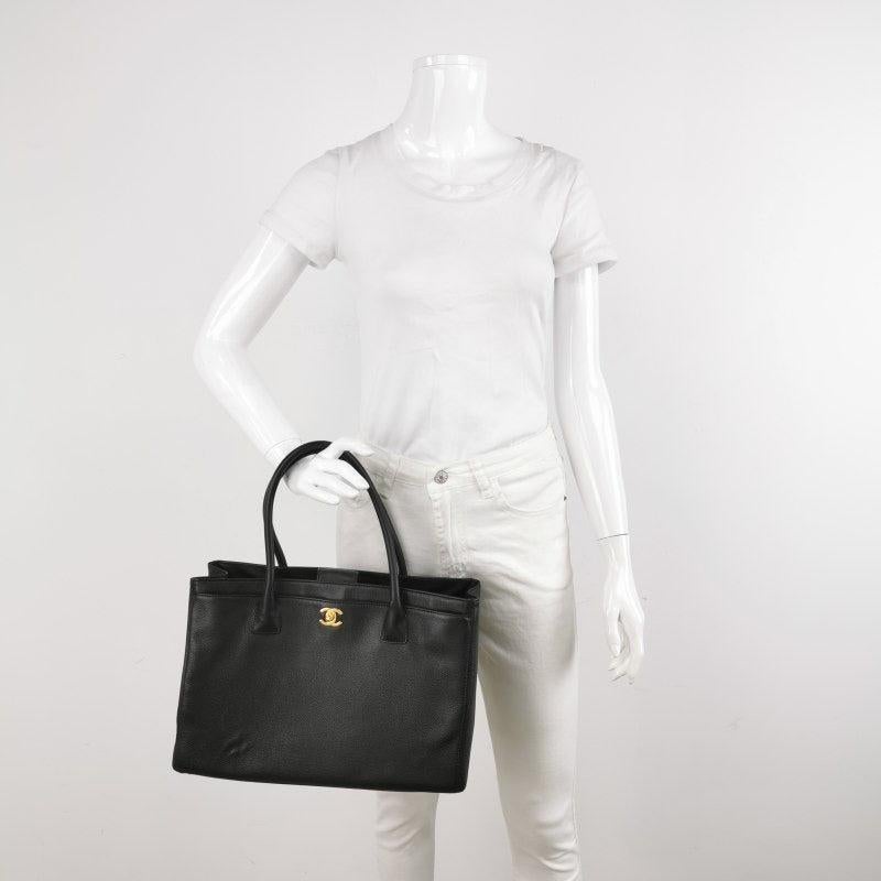 Chanel Cerf Executive Black Caviar Leather Handbag Gold Hardware
 These are professional photos of the actual bag.
 The iconic Chanel Cerf tote was introduced in 2005 as a timeless addition to Chanel's renowned classic collection. Crafted from high