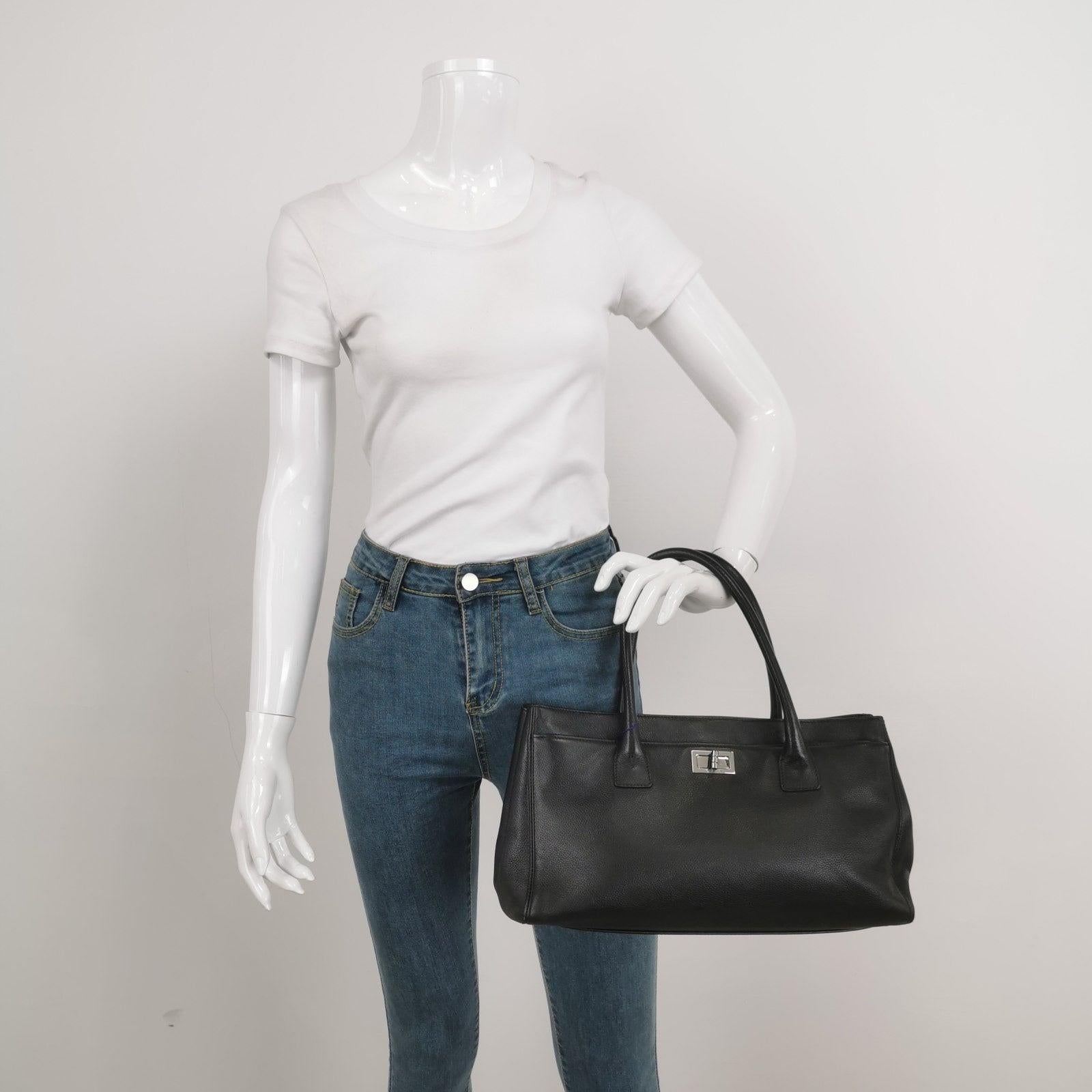 Chanel Cerf Executive East West Small Black Caviar Leather Handbag
  These are professional photos of the actual bag.
  The iconic Chanel Cerf tote was introduced in 2005 as a timeless addition to Chanel's renowned classic collection. Crafted from
