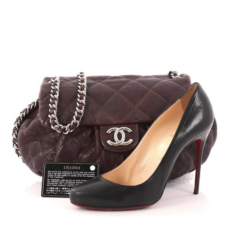 This authentic Chanel Chain Around Flap Bag Quilted Leather Medium is a beautiful addition to your collection. Crafted in dark brown quilted leather, this soft pleated flap bag features woven-in leather chain strap, chain-around design, frontal flap