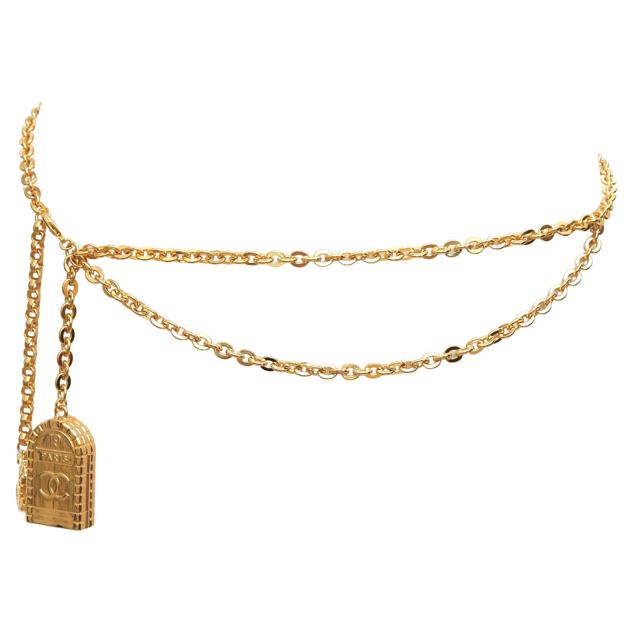 GUARANTEED AUTHENTIC CHANEL 2023 CHAIN BELT WITH HANGING CHARMS

Details:
- Gold-tone metal chain link style waist belt from the 2023 collection.
- Chain drop.
- Hanging CC and first Chanel store charm.
- Clasp closure.
- Comes with original box,