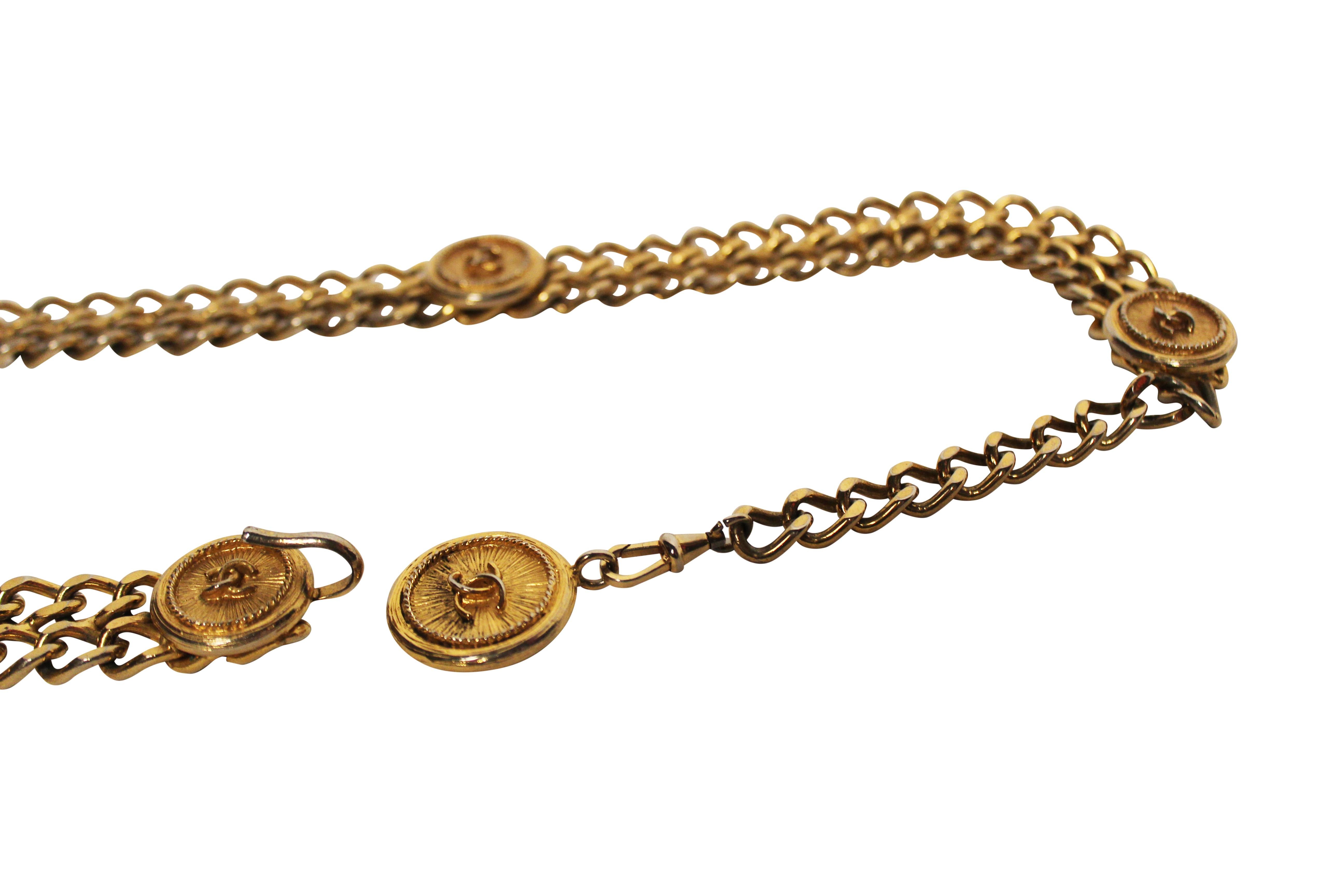Rare 1980's gold toned CHANEL double chain belt with hook fastner. This iconic vintage piece features five CHANEL CC medallions, as well as one four leaf clover medallion. Signed CHANEL on clasp.

Total length 76cm but can be hooked to fit any