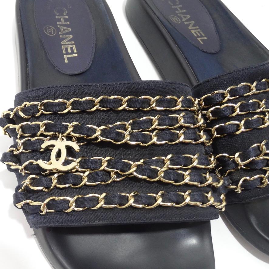 Super comfortable and fun Chanel chain link slides circa 2010s! Classic slip ons with a black and gold hardware chain link motif. The right one features a Chanel double 'C' charm as the finishing touch. Perfect for any collector looking for