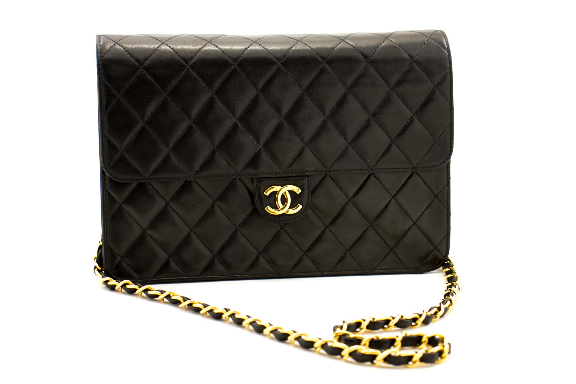 An authentic CHANEL Chain Shoulder Bag Clutch Black Quilted Flap made of black Lambskin Purse. The color is Black. The outside material is Leather. The pattern is Solid. This item is Vintage / Classic. The year of manufacture would be