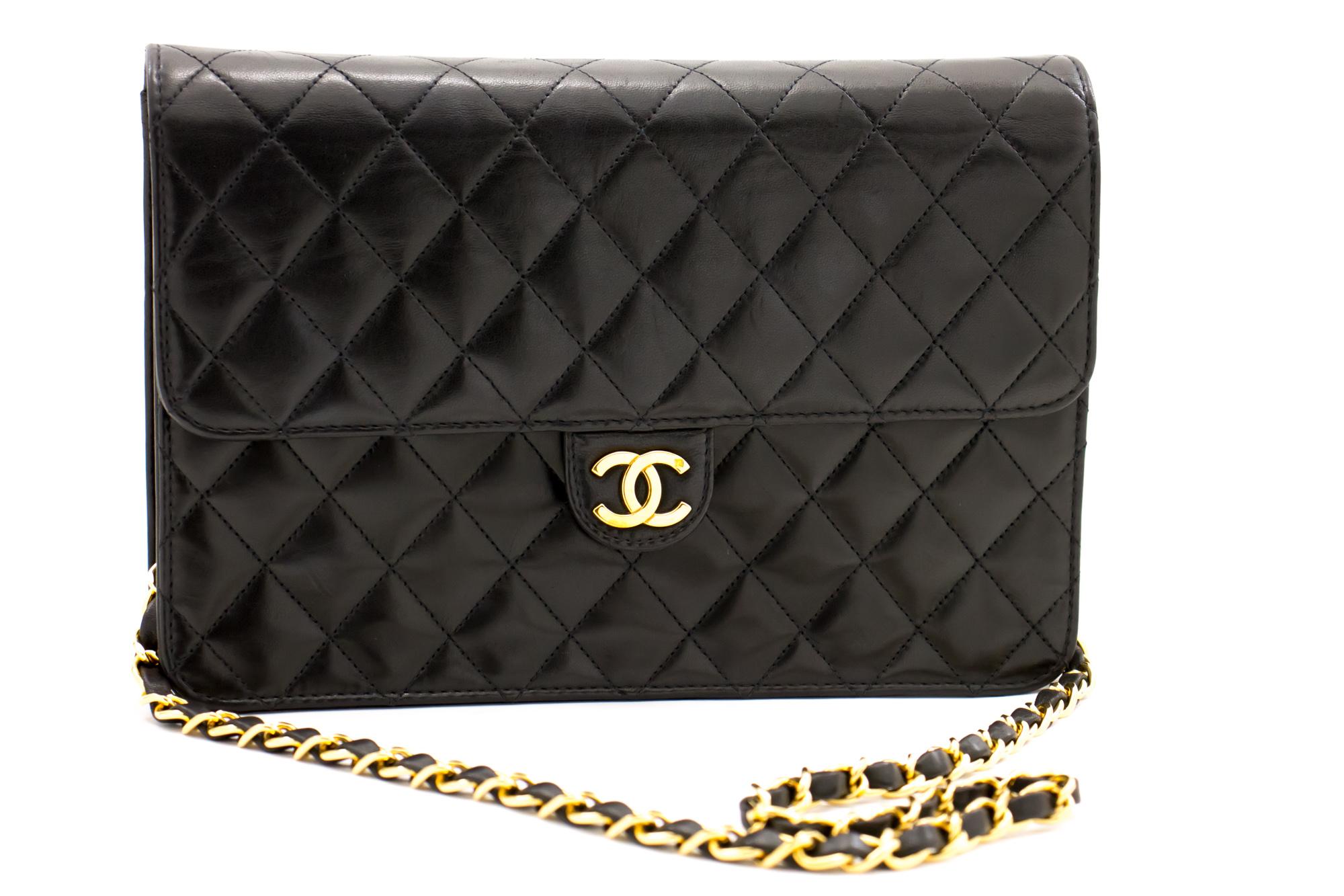 An authentic CHANEL Chain Shoulder Bag Clutch Black Quilted Flap made of black Lambskin Purse. The color is Black. The outside material is Leather. The pattern is Solid. This item is Vintage / Classic. The year of manufacture would be