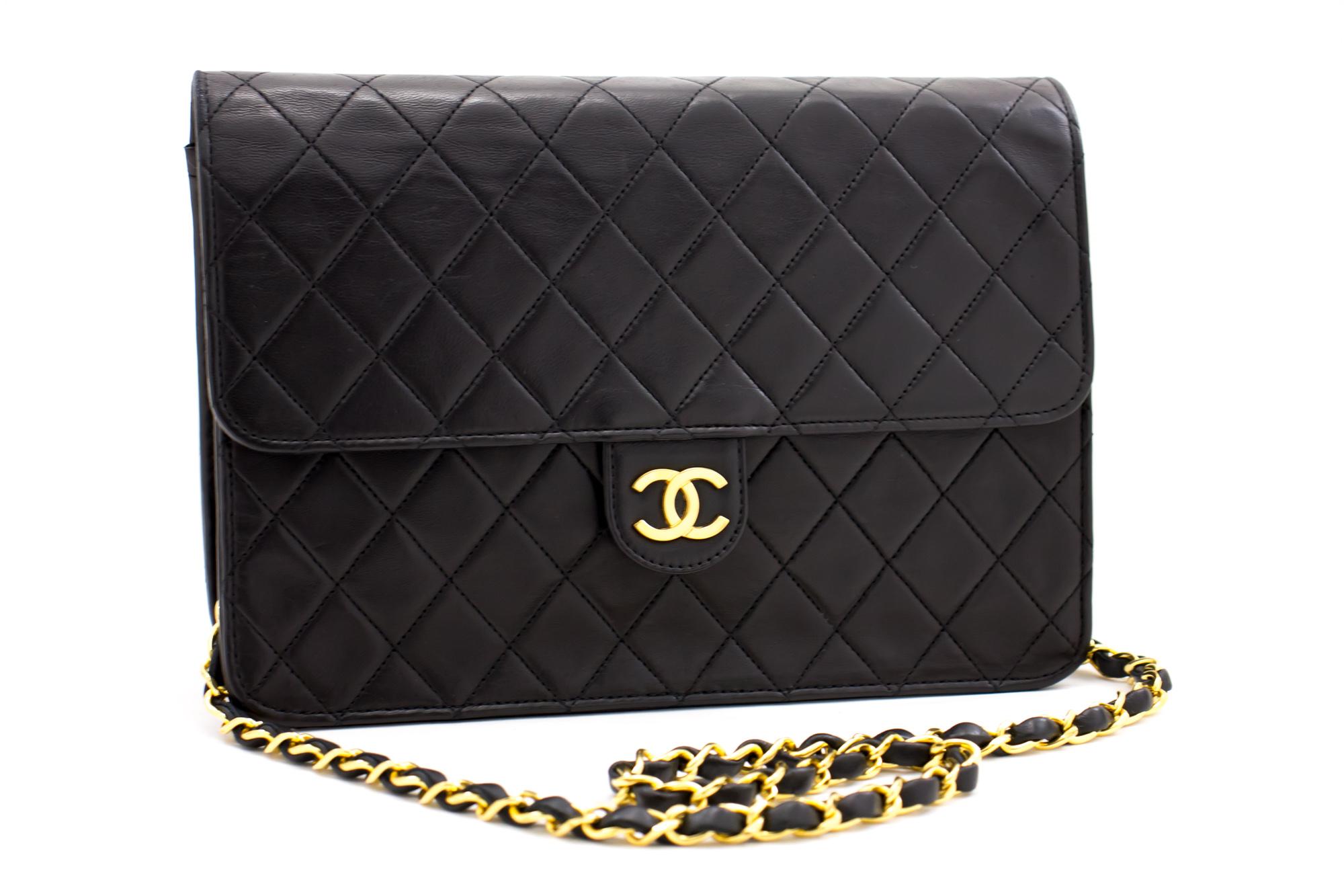 An authentic CHANEL Chain Shoulder Bag Clutch Black Quilted Flap made of black Lambskin Purse. The color is Black. The outside material is Leather. The pattern is Solid. This item is Vintage / Classic. The year of manufacture would be