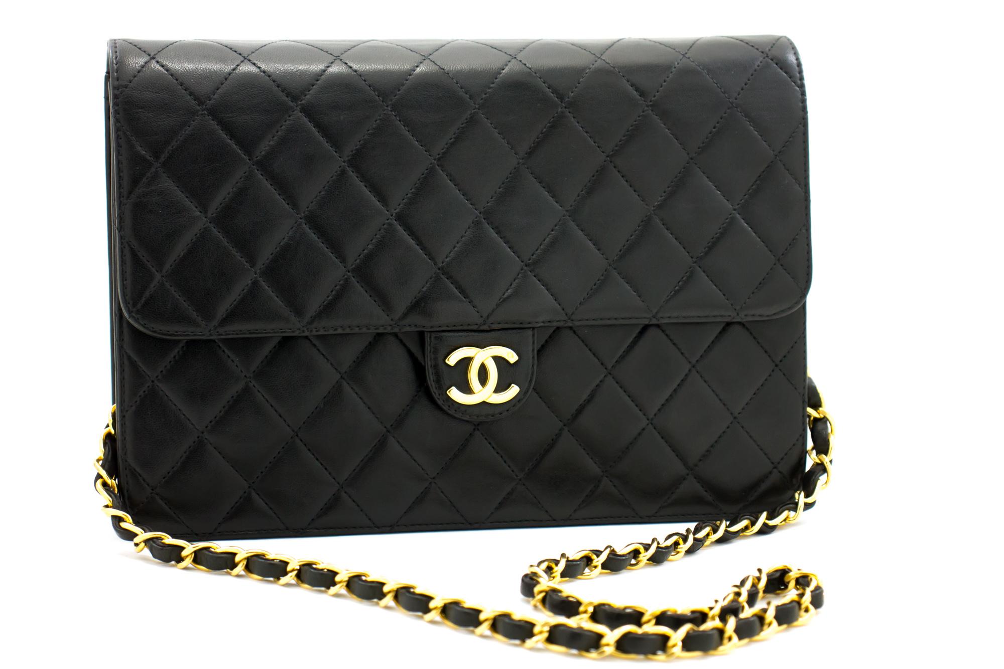 An authentic CHANEL Chain Shoulder Bag Clutch Black Quilted Flap made of black Lambskin Purse. The color is Black. The outside material is Leather. The pattern is Solid. This item is Vintage / Classic. The year of manufacture would be