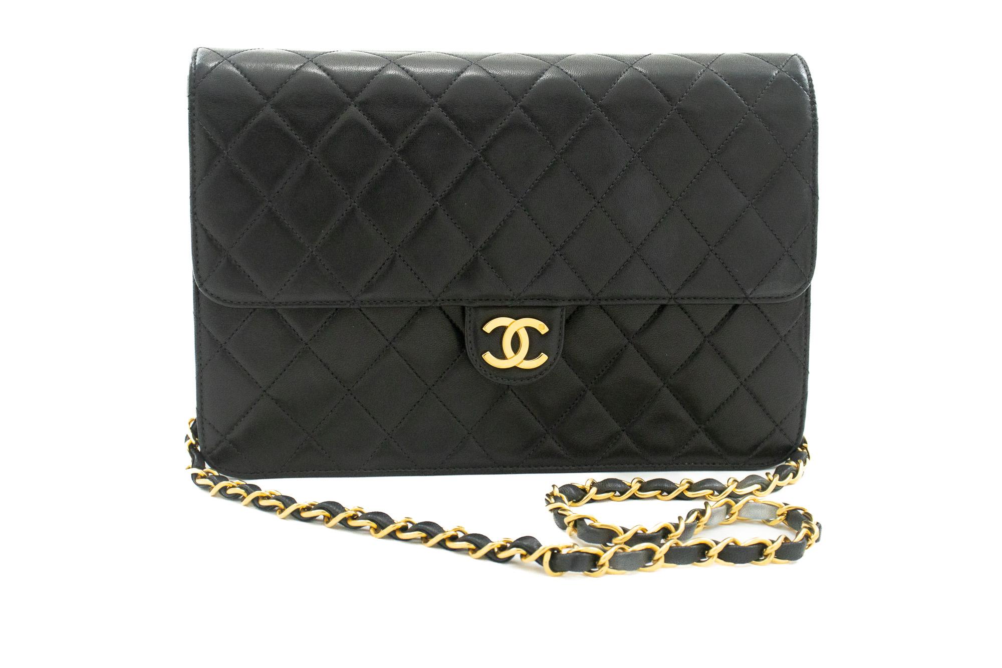 An authentic CHANEL Chain Shoulder Bag Clutch Black Quilted Flap made of black Lambskin Purse. The color is Black. The outside material is Leather. The pattern is Solid. This item is Vintage / Classic. The year of manufacture would be