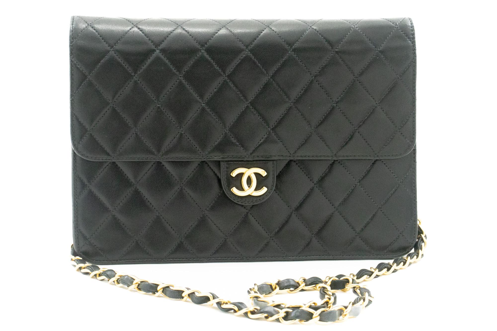 An authentic CHANEL Chain Shoulder Bag Clutch Black Quilted Flap made of black Lambskin Purse. The color is Black. The outside material is Leather. The pattern is Solid. This item is Vintage / Classic. The year of manufacture would be 2000-2 0 0 2