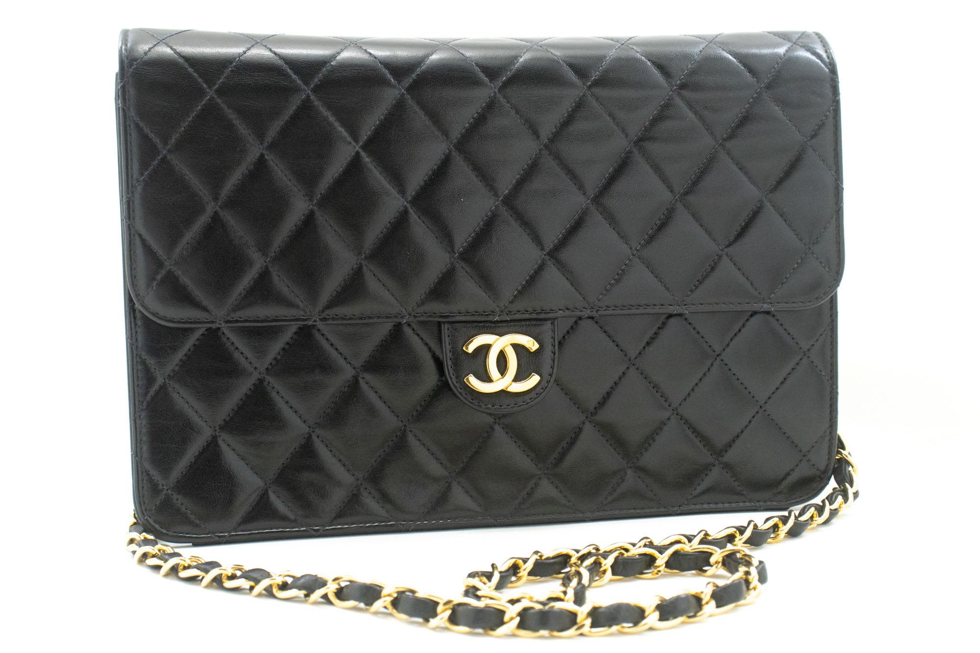 An authentic CHANEL Chain Shoulder Bag Clutch Black Quilted Flap made of black Lambskin Purse. The color is Black. The outside material is Leather. The pattern is Solid. This item is Vintage / Classic. The year of manufacture would be
