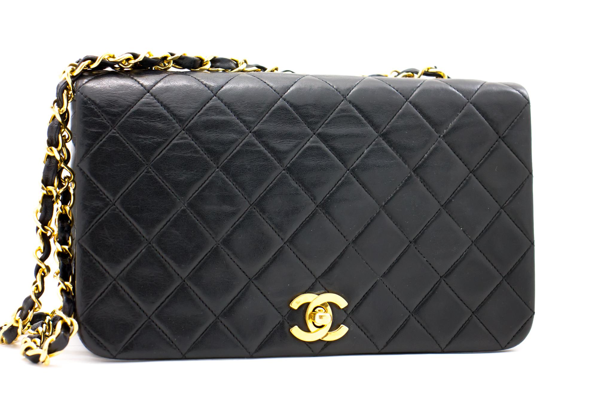 An authentic CHANEL Chain Shoulder Bag Black Quilted Flap made of black Lambskin Leather. The color is Black. The outside material is Leather. The pattern is Solid. This item is Vintage / Classic. The year of manufacture would be
