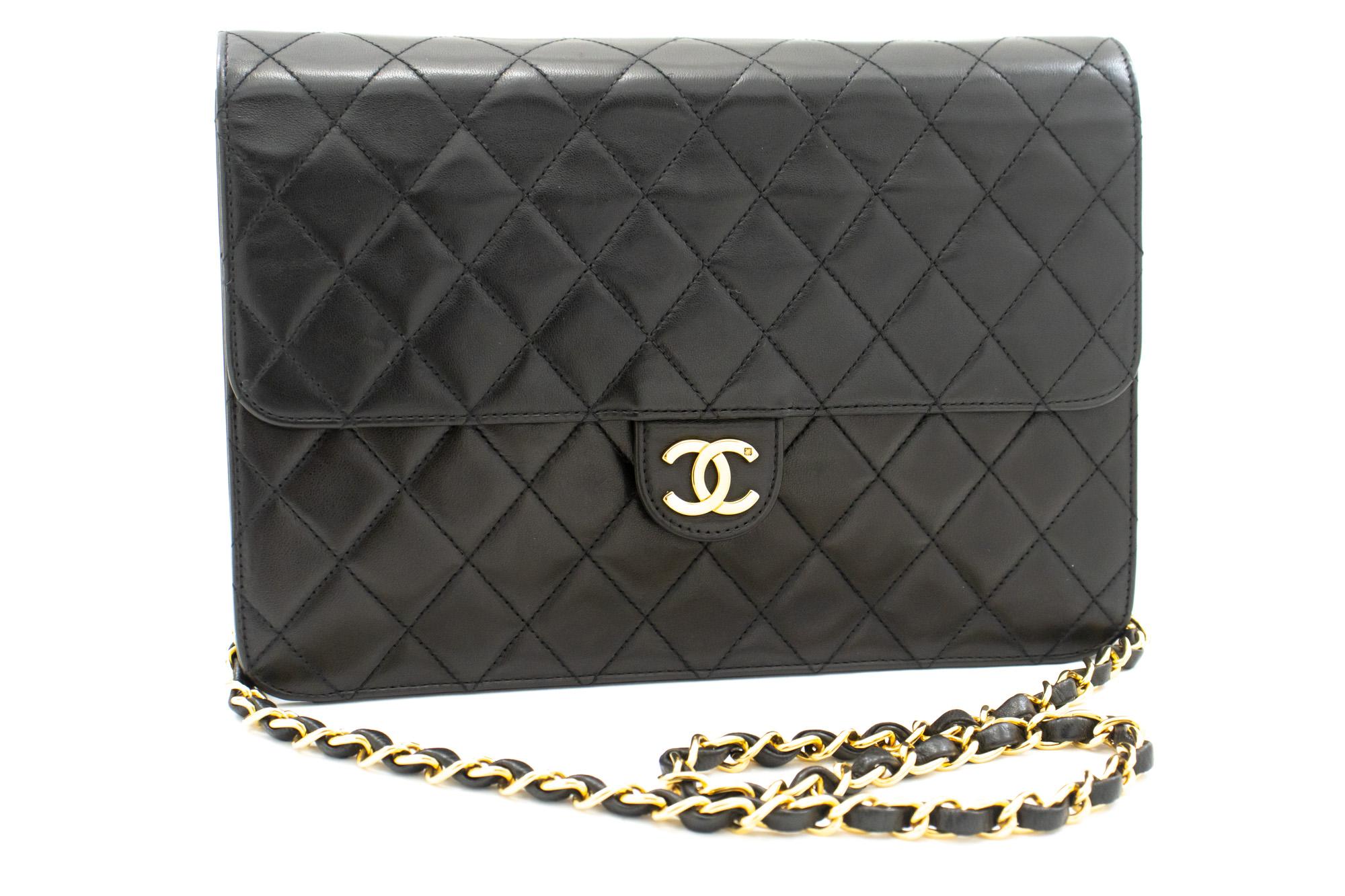 An authentic CHANEL Chain Shoulder Bag Clutch Dark Navy Quilted Flap made of black Lambskin. The color is Navy. The outside material is Leather. The pattern is Solid. This item is Vintage / Classic. The year of manufacture would be