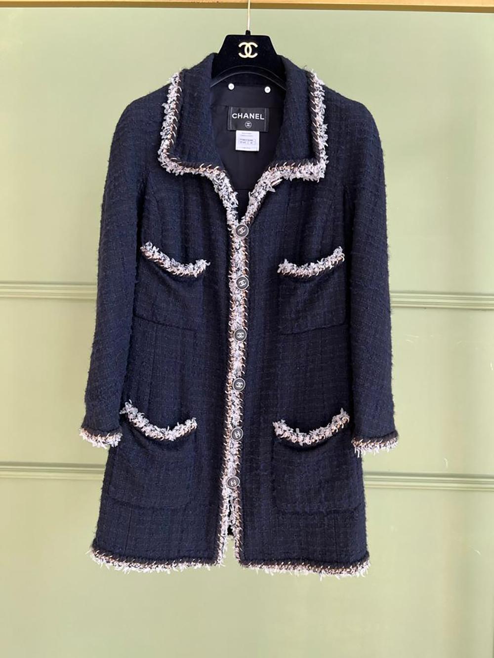 Rare, collectors Chanel black and blue tweed jacket with metallic chain trim detailing. 
Fully lined with 100% silk.
Size mark 40 FR. Excellent condition, only worn a few times.
