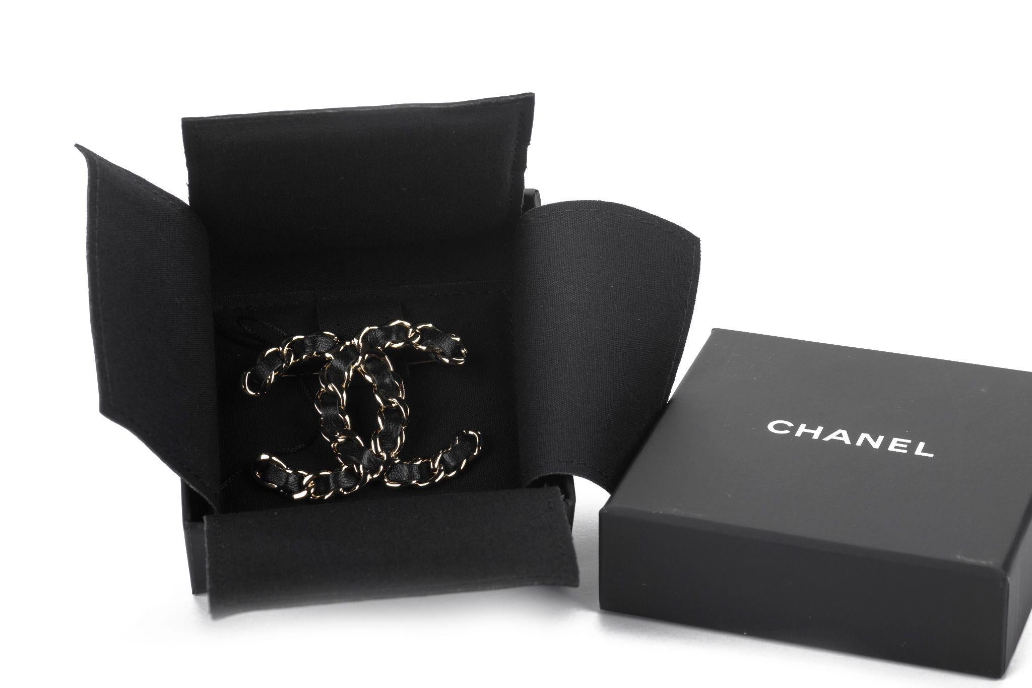 Chanel brand new champagne gold chain logo pin with black woven leather. 
Collection 2022 V. Original pouch, Box and ribbon.