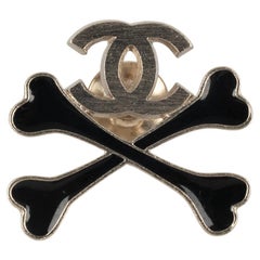 Chanel Champagne Metal Pin Label Enameled with Black