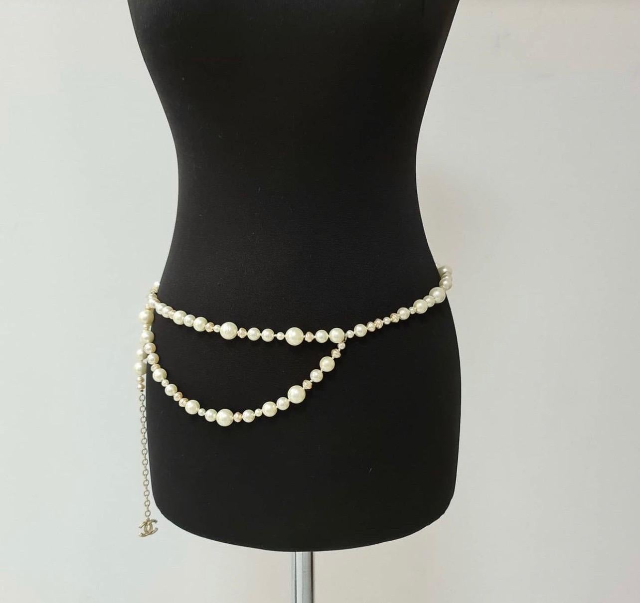 Chanel 10A Faux Pearl CC Logo Belt Necklace features gorgeous faux pearl details, with CC logo detail. Wear as a necklace or a belt! 
Overall Condition: Excellent

Material: Metal, Faux Pearl

Includes: None

Origin: France

Production Year: