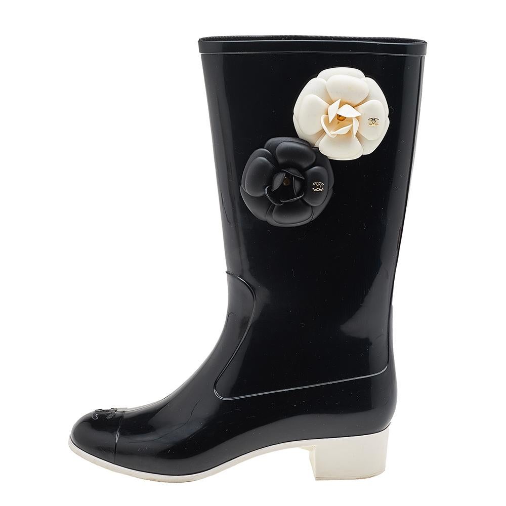 These gorgeous Chanel Camellia Flower rain boots will brighten up your cloudy day! These adorable boots feature two Camellia flowers in white and black with gold CC logos, the classic CC logo at the toe caps and lined insoles for added