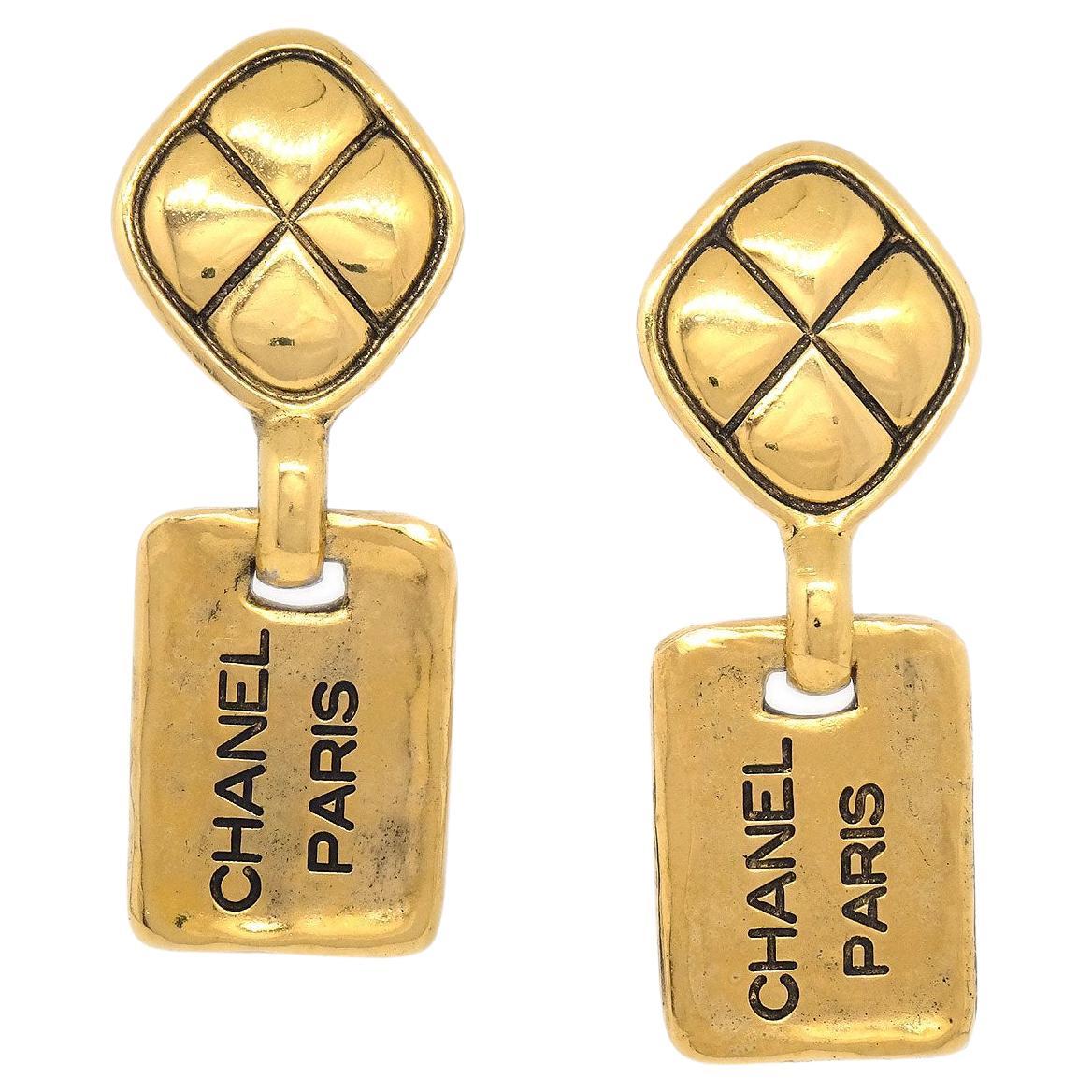 CHANEL 'CHANEL PARIS' Logo Gold Metal Evening Dangle Drop Earrings For Sale