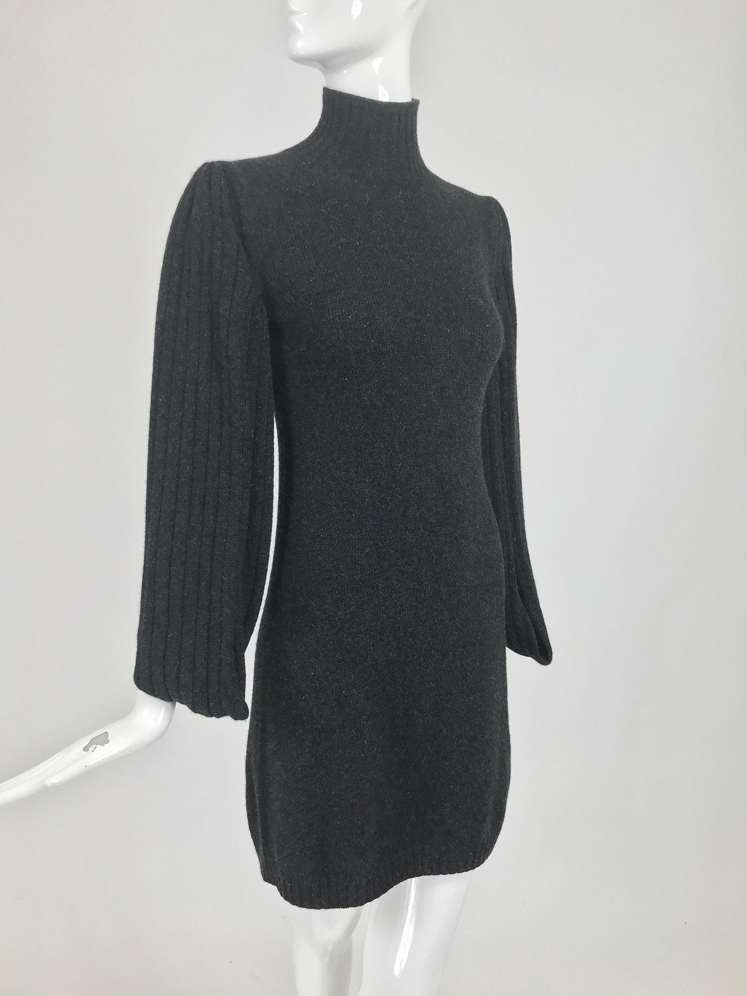 Chanel charcoal grey cashmere cage sleeve dress 2007a. This gorgeous dress is so soft, with the most unusual sleeves, they are open at the front and and back from cuff to under arm, they have v openings at the cuff for your hands. The sleeves are