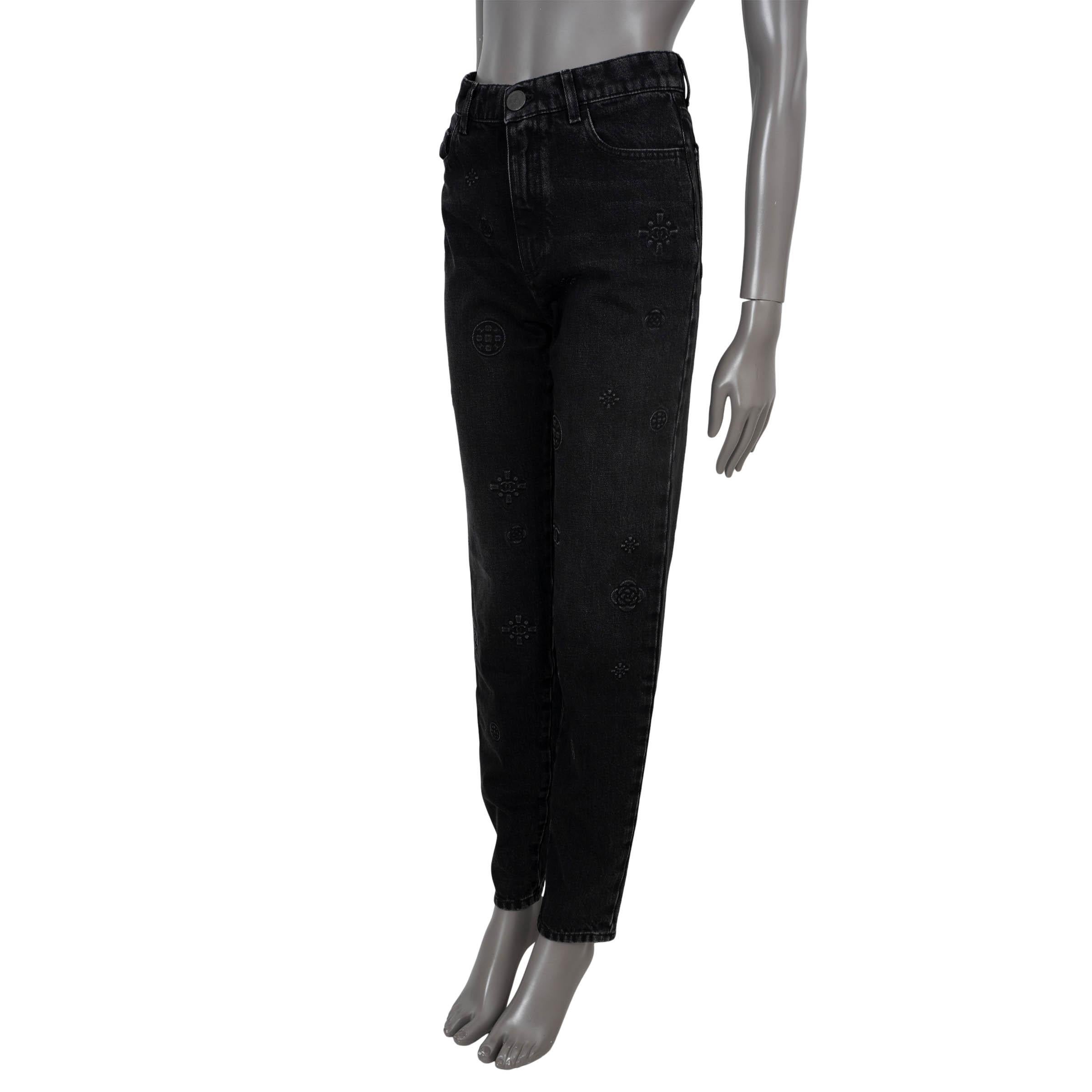 100% authentic Chanel tapered-leg jeans in charcoal grey denim cotton. Feature a high waist, all-over logo embossing and classic five pocket design. Open with a metal logo button and concealed zipper on the front. Has been worn and is in excellent